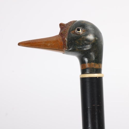 313 - An Antique 19th Century carved and painted wooden duck head handle walking cane, (possibly a Shelduc... 