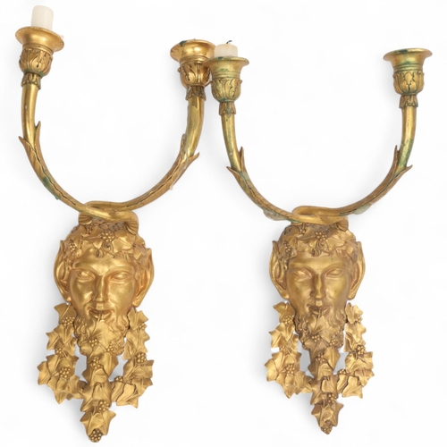 334 - A pair of Neo-Classical gilt-bronze satyr mask twin-branch wall sconces, height 38cm
