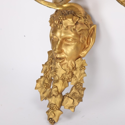 334 - A pair of Neo-Classical gilt-bronze satyr mask twin-branch wall sconces, height 38cm