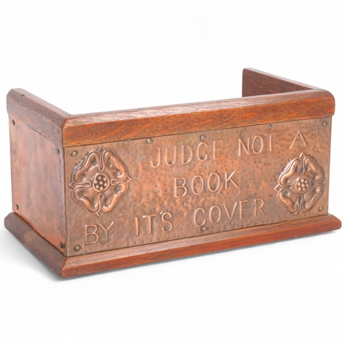 347 - Arts and Crafts oak and copper mounted book rack, inscribed 