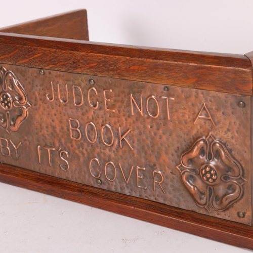 347 - Arts and Crafts oak and copper mounted book rack, inscribed 