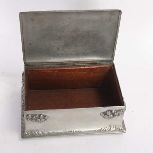 348 - An Art Nouveau pewter cigarette box, with relief fruit decoration, width 15cm