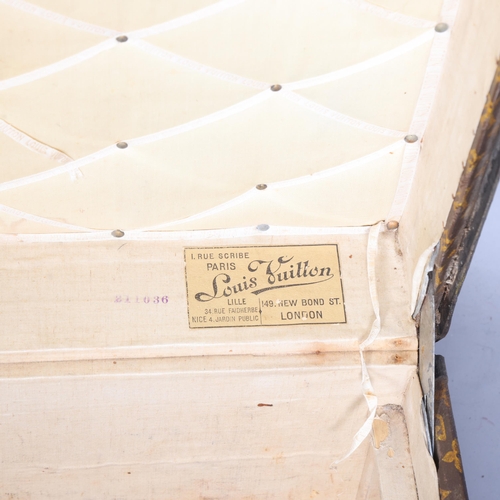 330A - LOUIS VUITTON - a Vintage monogram steamer trunk, brass furniture, lined interior and original label... 