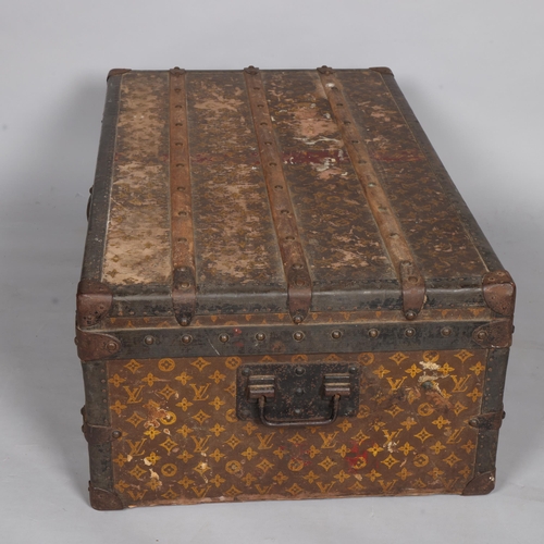 330A - LOUIS VUITTON - a Vintage monogram steamer trunk, brass furniture, lined interior and original label... 