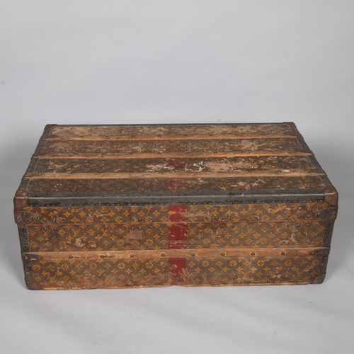 330A - LOUIS VUITTON - a Vintage monogram steamer trunk, brass furniture, lined interior and original label... 