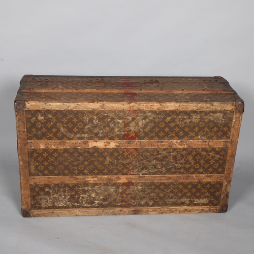 330A - LOUIS VUITTON - a Vintage monogram steamer trunk, brass furniture, lined interior and original label... 