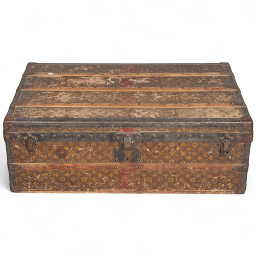 330A - LOUIS VUITTON - a Vintage monogram steamer trunk, brass furniture, lined interior and original label... 