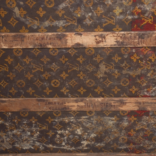 330A - LOUIS VUITTON - a Vintage monogram steamer trunk, brass furniture, lined interior and original label... 