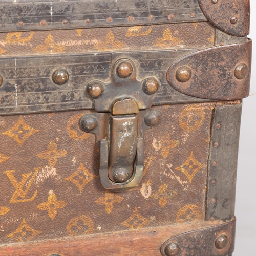 330A - LOUIS VUITTON - a Vintage monogram steamer trunk, brass furniture, lined interior and original label... 