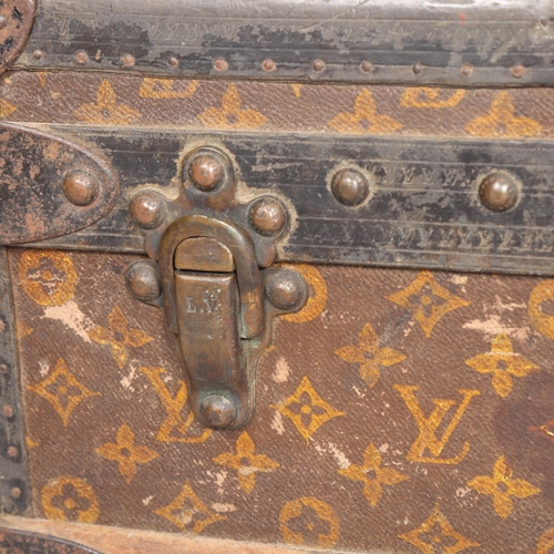 330A - LOUIS VUITTON - a Vintage monogram steamer trunk, brass furniture, lined interior and original label... 