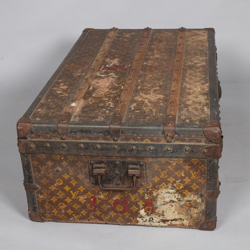 330A - LOUIS VUITTON - a Vintage monogram steamer trunk, brass furniture, lined interior and original label... 