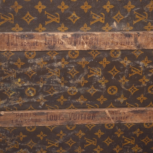 330A - LOUIS VUITTON - a Vintage monogram steamer trunk, brass furniture, lined interior and original label... 