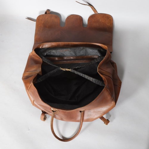 331A - A gents vintage large brown leather travelling bag, with black fabric lining, approx length 50cm, de... 