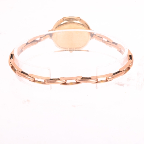 1024 - An Antique 9ct rose gold Officer's style mechanical bracelet watch, white enamel dial with black Rom... 
