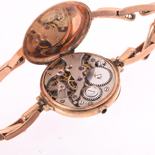 1024 - An Antique 9ct rose gold Officer's style mechanical bracelet watch, white enamel dial with black Rom... 