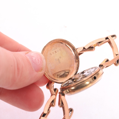 1024 - An Antique 9ct rose gold Officer's style mechanical bracelet watch, white enamel dial with black Rom... 