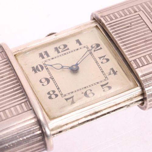 1053 - An Art Deco Swiss silver automatic purse watch, circa 1930, silvered dial with black Arabic numerals... 