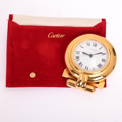 1064 - CARTIER - a gilt-metal 'Colisee' quartz alarm desk clock, round white dial with black Roman numeral ... 