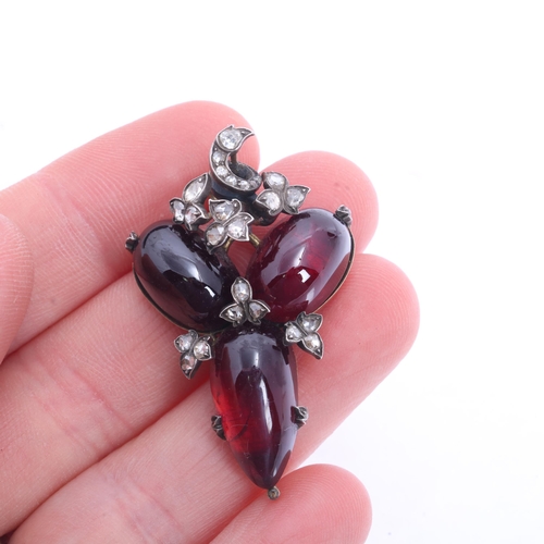 1101 - An Antique Victorian garnet and diamond pendant, circa 1860, set with 3 oval cabochon carbuncle foil... 