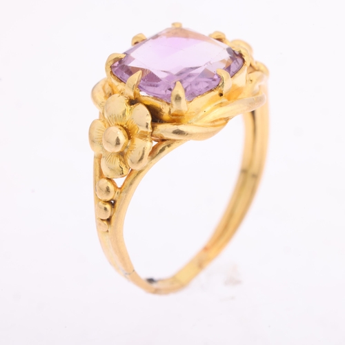 1103 - An Art Nouveau 18ct gold single stone amethyst dress ring, claw set with cushion-cut amethyst and fl... 