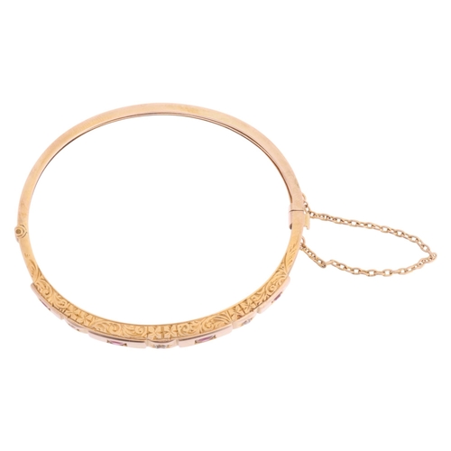 1105 - An Antique Victorian 9ct rose gold seven stone ruby and diamond hinged bangle, circa 1900, set with ... 