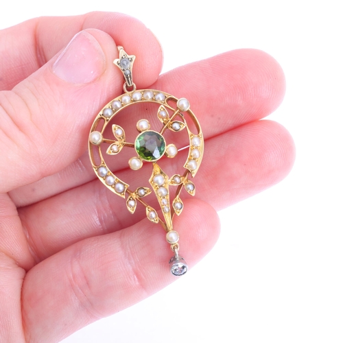 1106 - An Art Nouveau Edwardian 15ct gold green tourmaline diamond and split pearl openwork pendant, circa ... 
