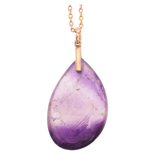 1108 - An Antique amethyst armorial intaglio pendant necklace, the polished teardrop amethyst pebble intagl... 
