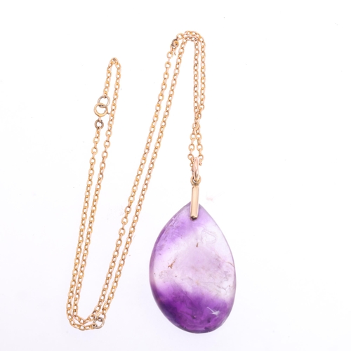 1108 - An Antique amethyst armorial intaglio pendant necklace, the polished teardrop amethyst pebble intagl... 