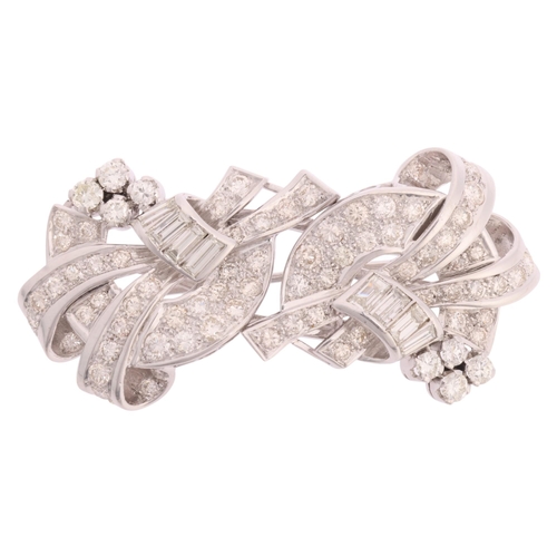 1112 - A Retro platinum diamond double-clip brooch, circa 1950, scrolling ribbon form, each clip detachable... 