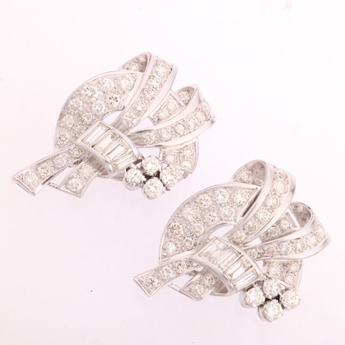 1112 - A Retro platinum diamond double-clip brooch, circa 1950, scrolling ribbon form, each clip detachable... 