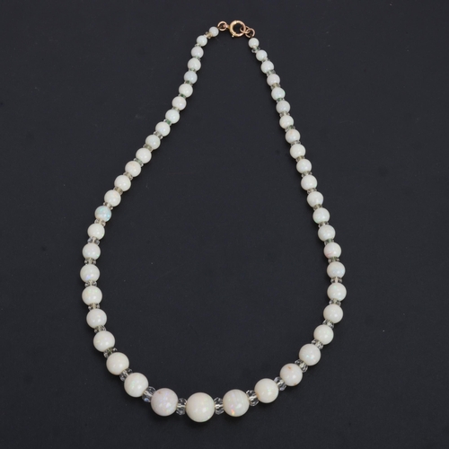 1114 - An Art Deco opal and paste collar necklace, set with graduated opal beads measuring from 12.6-4.6mm,... 