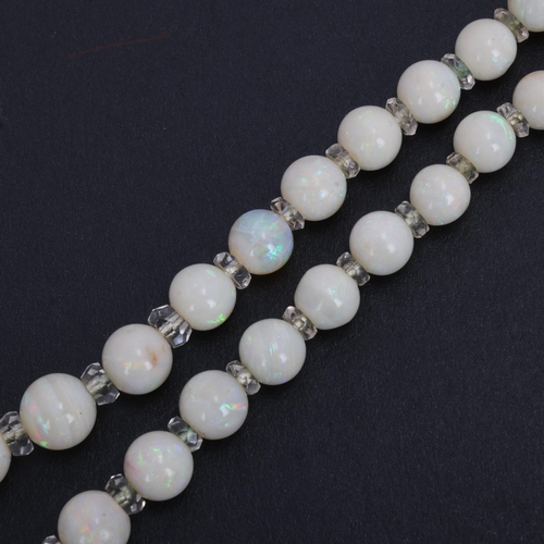 1114 - An Art Deco opal and paste collar necklace, set with graduated opal beads measuring from 12.6-4.6mm,... 