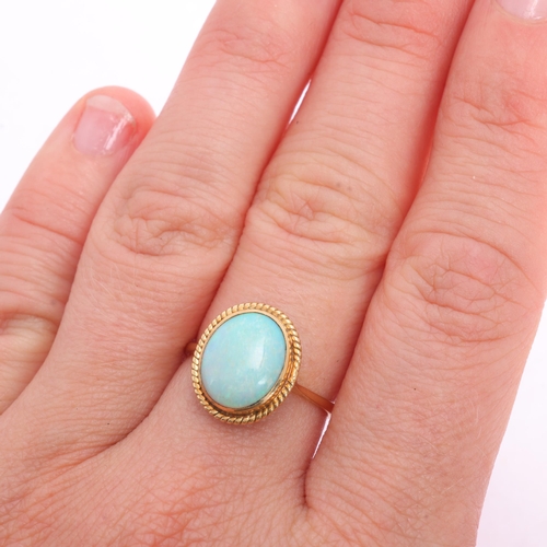 1115 - A 14ct gold opal dress ring, rub-over set with 1ct oval cabochon opal, in rope twist surround, setti... 