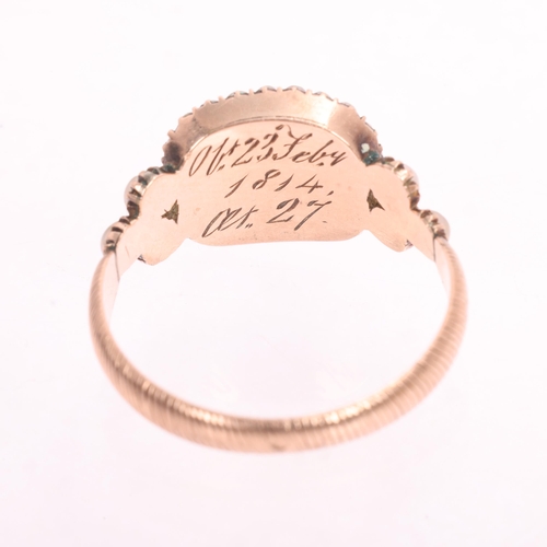 1119 - An Antique Georgian hairwork and pearl mourning ring, circa 1810, the rectangular compartment contai... 