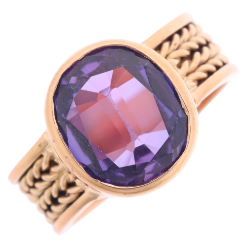 1125 - A Continental 18ct gold single stone synthetic sapphire dress ring, rub-over set with oval-cut synth... 