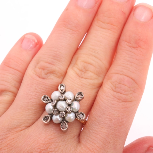 1129 - A Contemporary 12ct gold pearl and diamond flowerhead cluster ring, in the Georgian style, set with ... 
