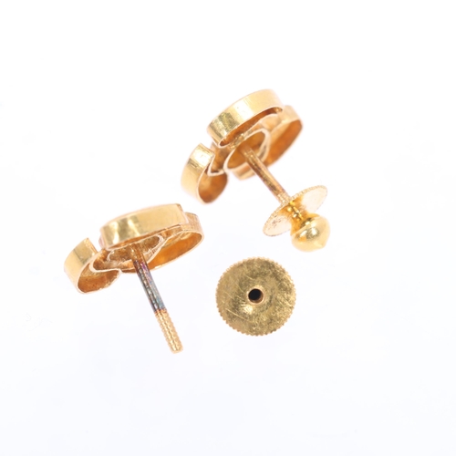 1130 - A pair of Continental 21ct gold stud earrings, abstract textured form, with screw-back fittings, unm... 