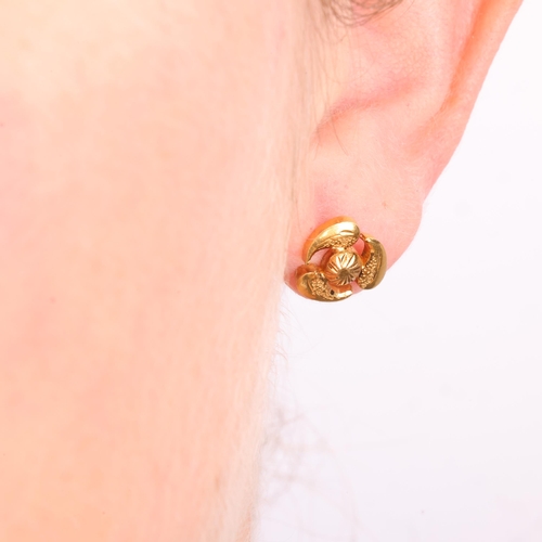 1130 - A pair of Continental 21ct gold stud earrings, abstract textured form, with screw-back fittings, unm... 