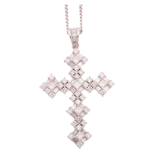 1134 - An 18ct white gold diamond cross pendant necklace, set with Princess baguette and modern round brill... 