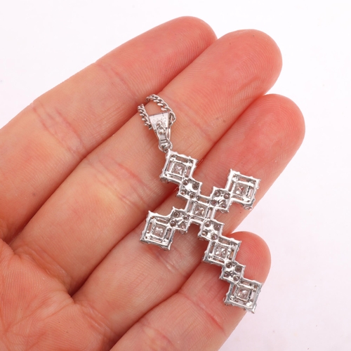 1134 - An 18ct white gold diamond cross pendant necklace, set with Princess baguette and modern round brill... 