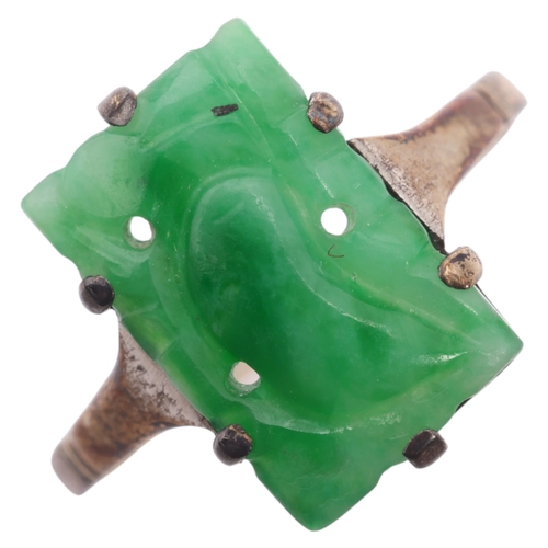 1203 - A Chinese 9ct gold jade panel ring, setting height 13.1mm, size K, 1.6g