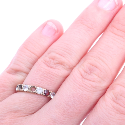 1207 - A Vintage 9ct gold garnet and white sapphire full eternity ring, band width 3.4mm, size K, 2.1g