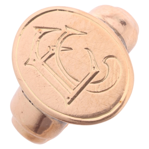 1209 - An Antique 9ct rose gold signet ring, oval panel with engraved initials EC, and stepped shoulders, s... 