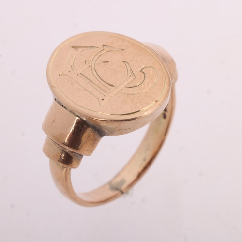 1209 - An Antique 9ct rose gold signet ring, oval panel with engraved initials EC, and stepped shoulders, s... 