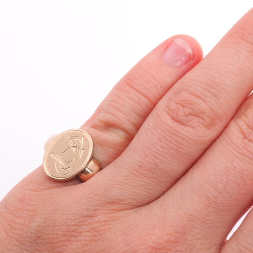 1209 - An Antique 9ct rose gold signet ring, oval panel with engraved initials EC, and stepped shoulders, s... 
