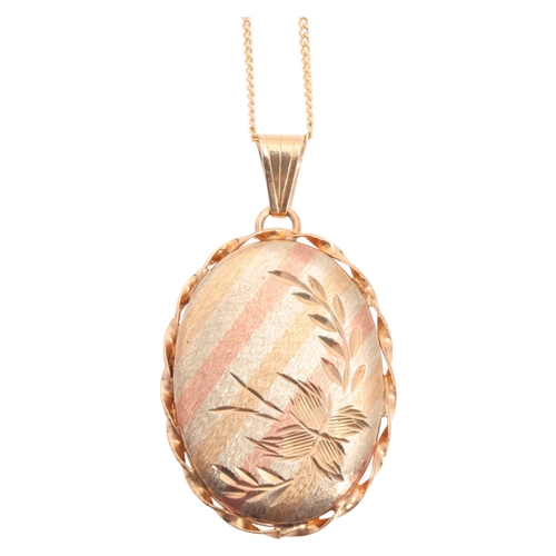 1210 - A 9ct three-colour gold locket pendant necklace, oval form, with textured and engraved decoration, o... 