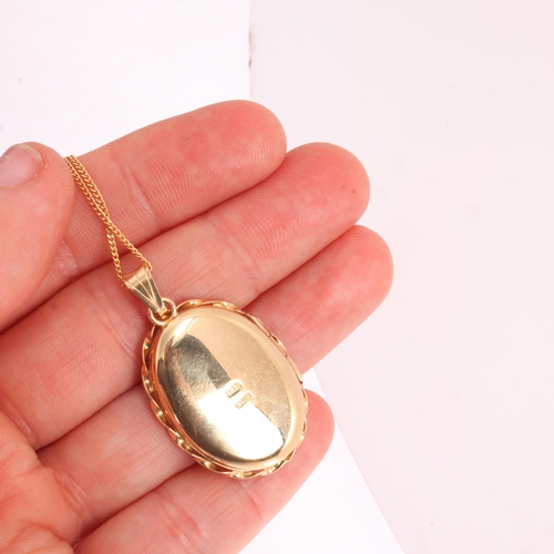 1210 - A 9ct three-colour gold locket pendant necklace, oval form, with textured and engraved decoration, o... 