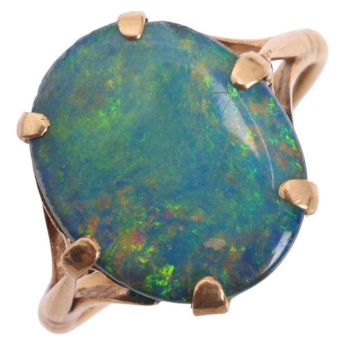 1211 - A Vintage 9ct gold black opal doublet dress ring, claw set with oval low cabochon black opal doublet... 