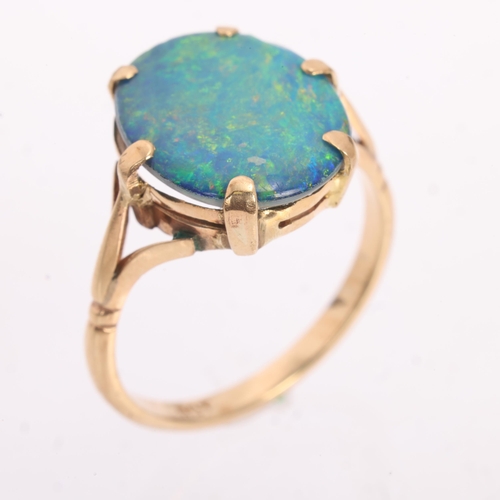 1211 - A Vintage 9ct gold black opal doublet dress ring, claw set with oval low cabochon black opal doublet... 