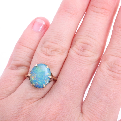 1211 - A Vintage 9ct gold black opal doublet dress ring, claw set with oval low cabochon black opal doublet... 